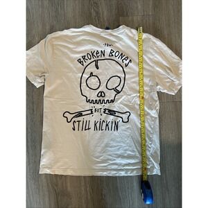H&M Divided "Few Broken Bones But Still Kicking" T Shirt Skull On Back Medium